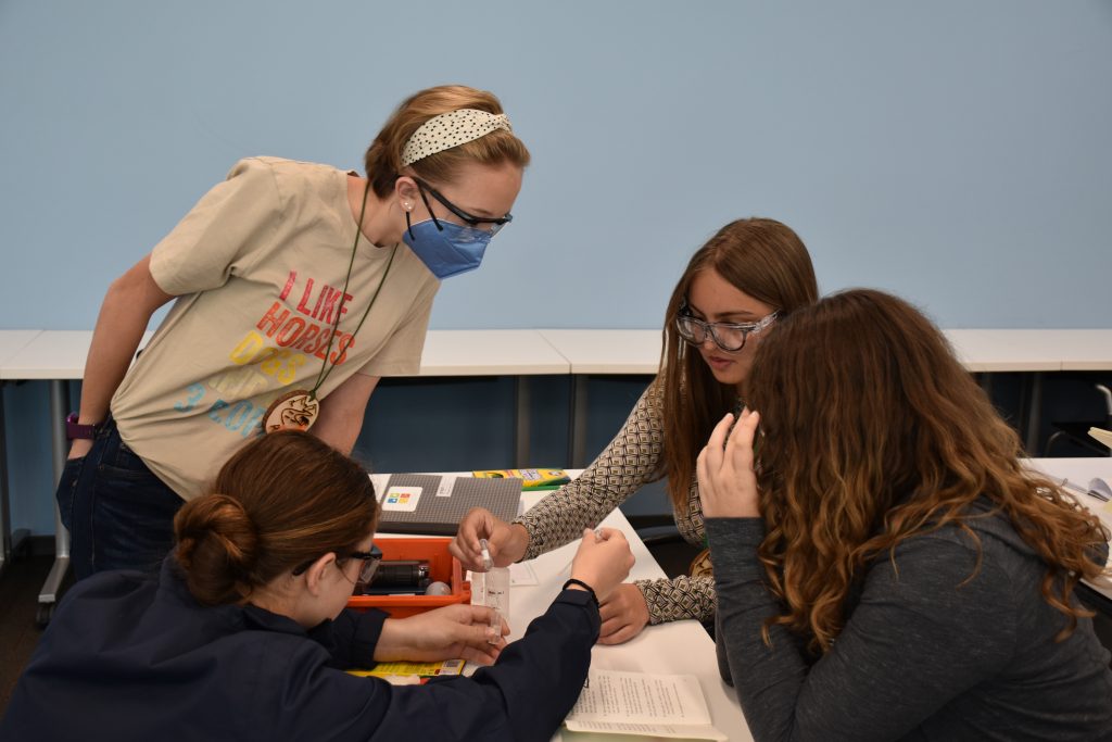 Students work on a STEM kit together